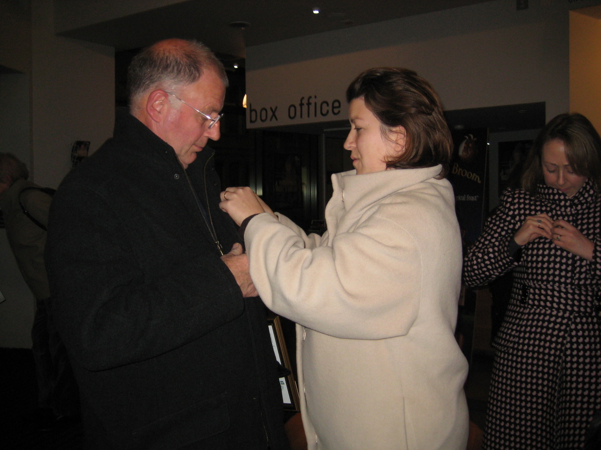 GUT's Andrea pins on a badge